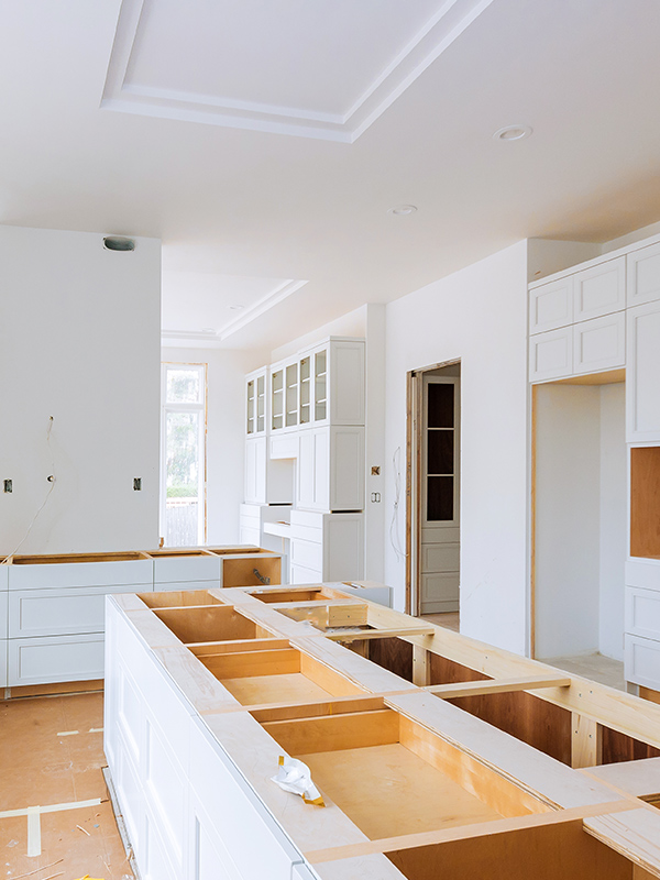 kitchen interiors with new white wooden cabinets installation in process kenner la