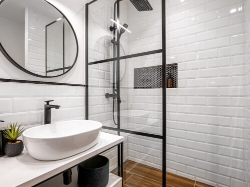 white bathroom interiors with black fixtures installed kenner la